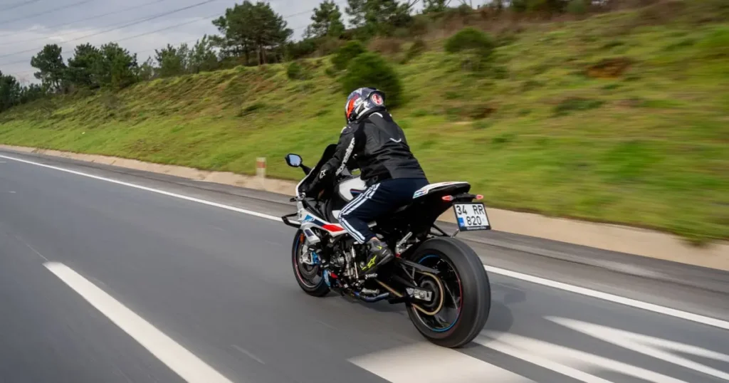 Motorcyclist riding on a two-lane road