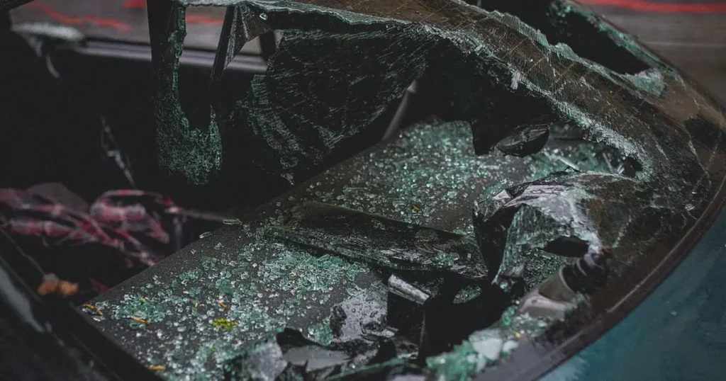 Shattered car windshield after a crash
