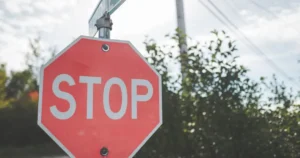 stop-sign-against-blue-sky Stop sign at an intersection