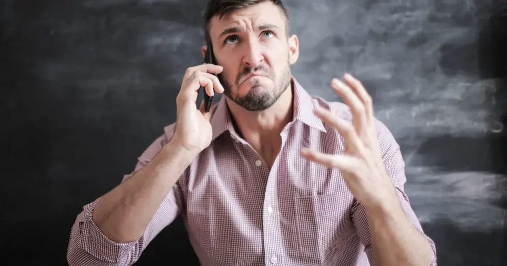 Stressed man on a phone call