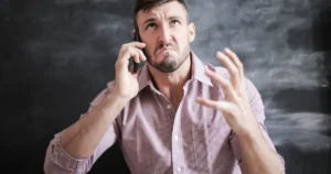 stressed-man-on-phone-call Stressed man on a phone call