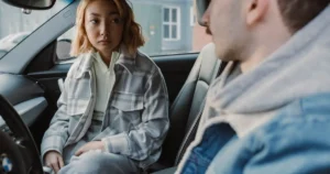 worried-passenger-in-car Worried passenger sitting in a car